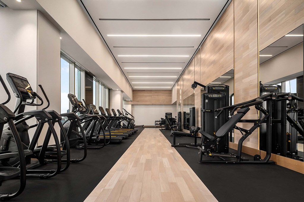 the gym is equipped with a variety of exercise equipment at The Paxton, Brooklyn, New York